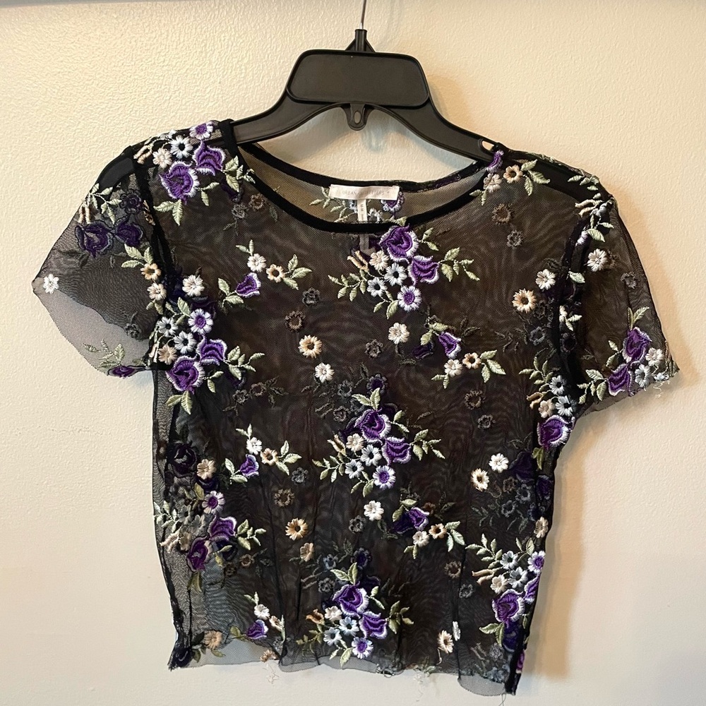 Mesh shirt with flowers.